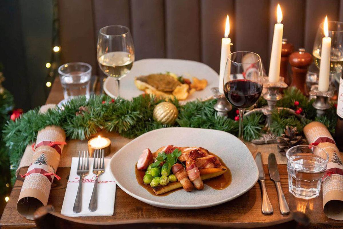 Christmas lunch with candles and crackers