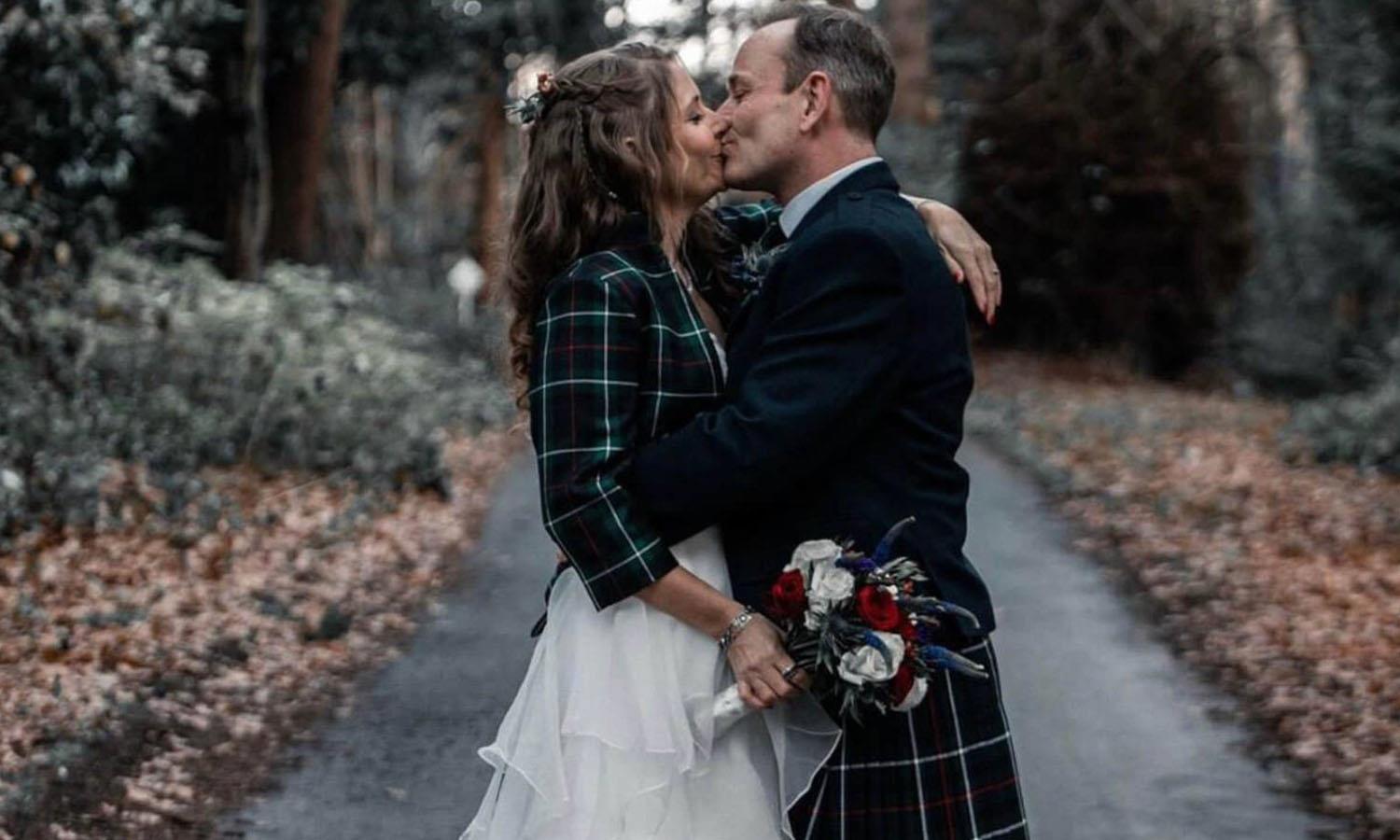 Wedding couple on Melville Castle estate wearing scottish tartan