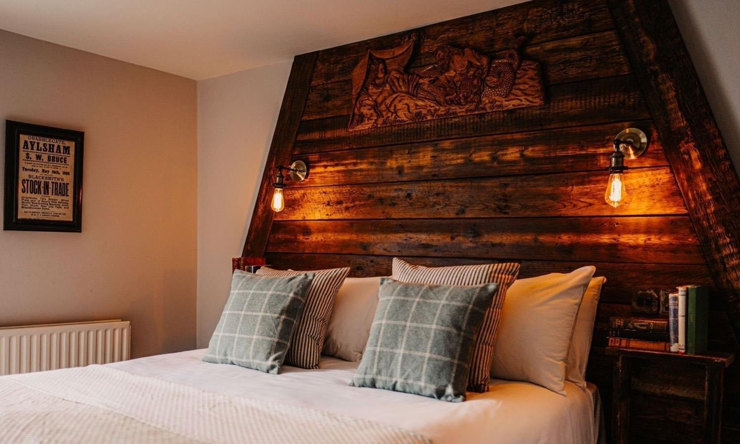 Nautical styled bedroom with bed and mariner's lamps 